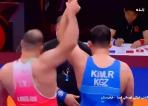 پهلوانی سنگین وزن و واکنش عجیب داور!(عکس)