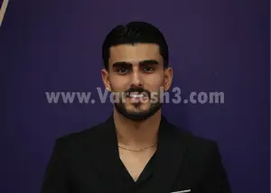 پیراهن سرخ بر تن برنده توپا چهارصد و چهار